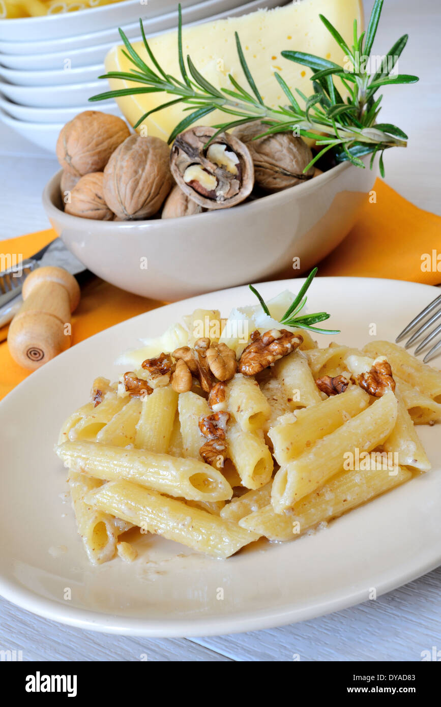 Italian rigatoni pasta with nuts cream and pecorino cheese Stock Photo