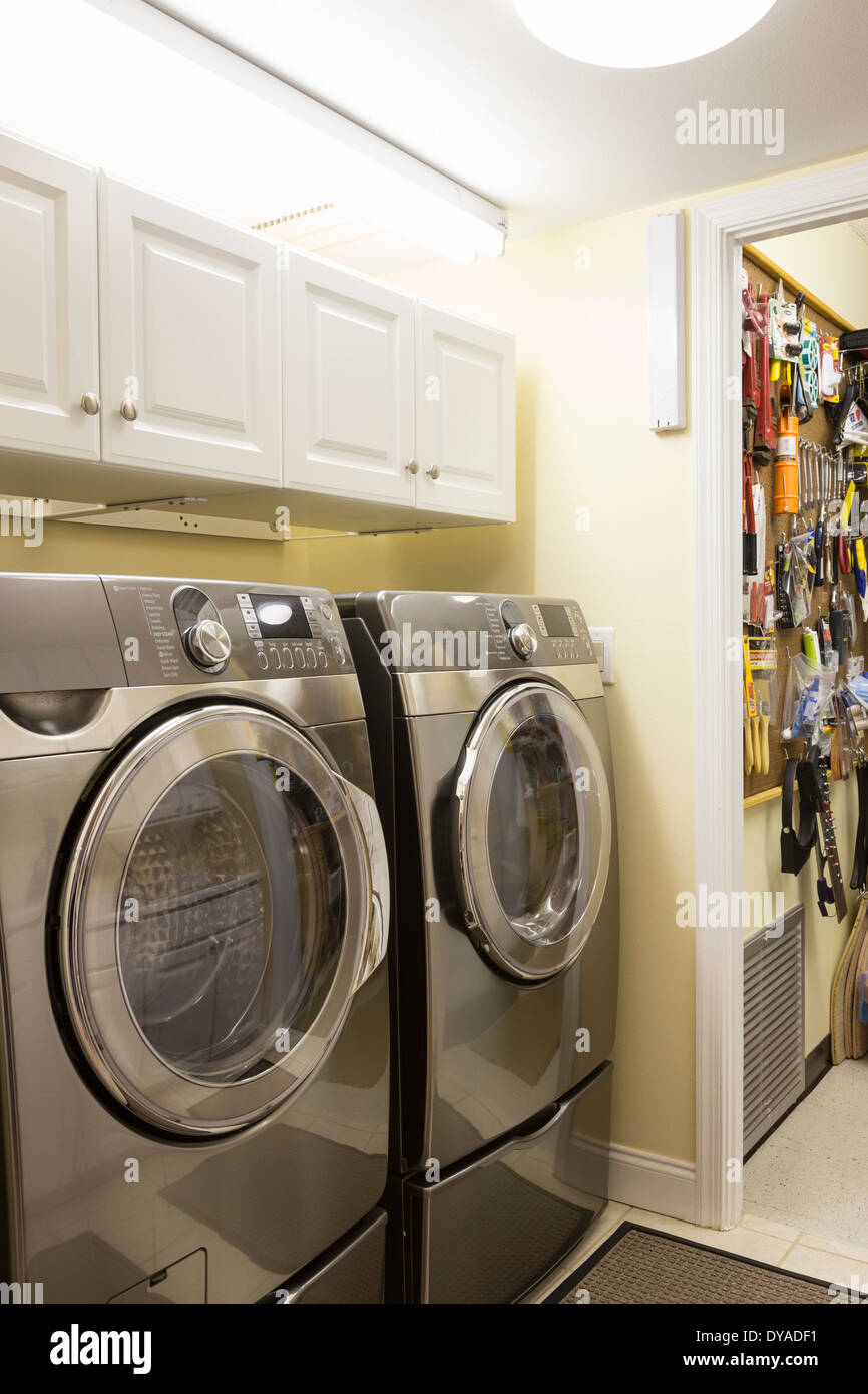 Showcase Residential Home Laundry Room with Modern Front Loading Washer