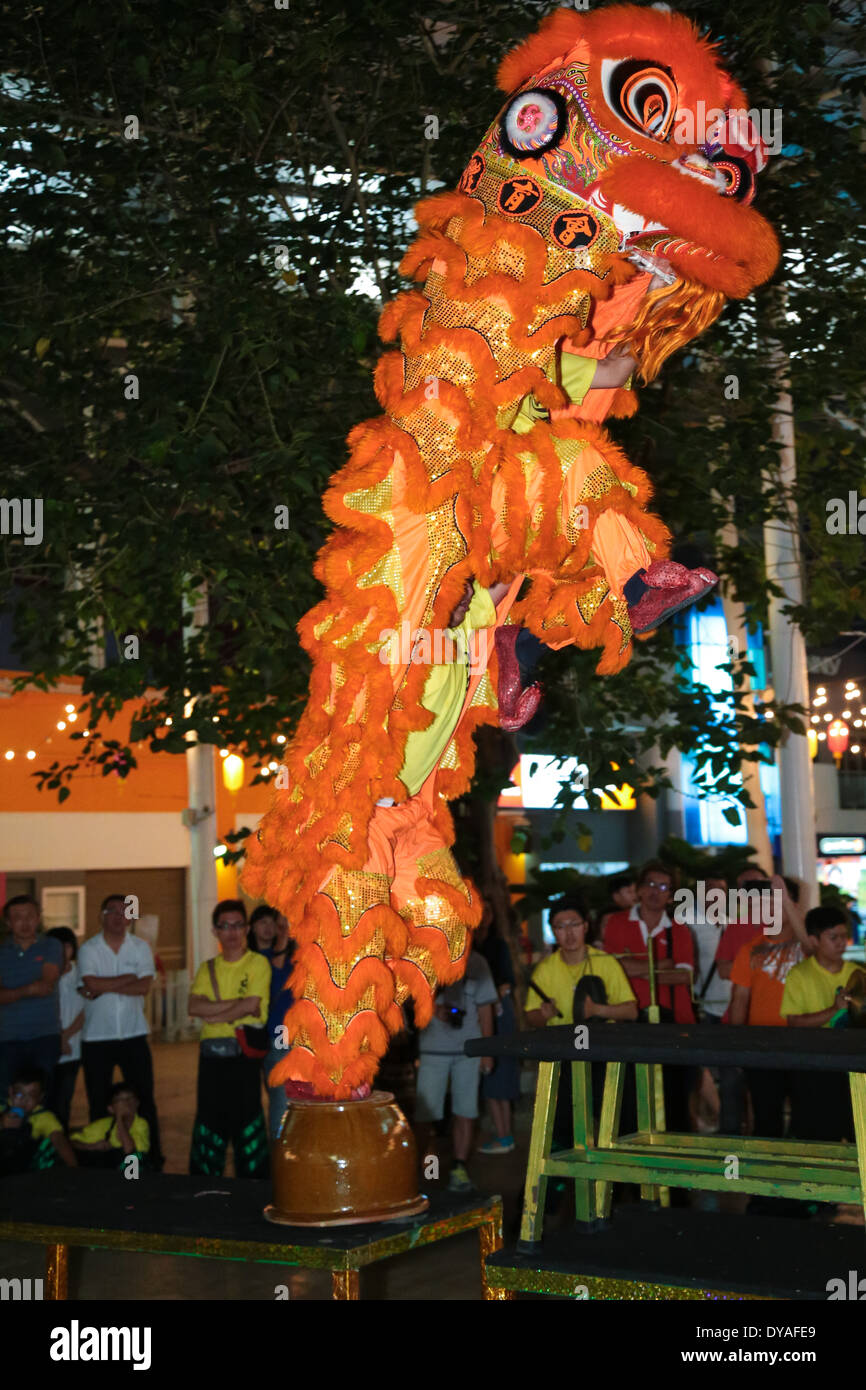 Lion dance performed by teenagers at a public premises during Chinese New Year 2014. Stock Photo