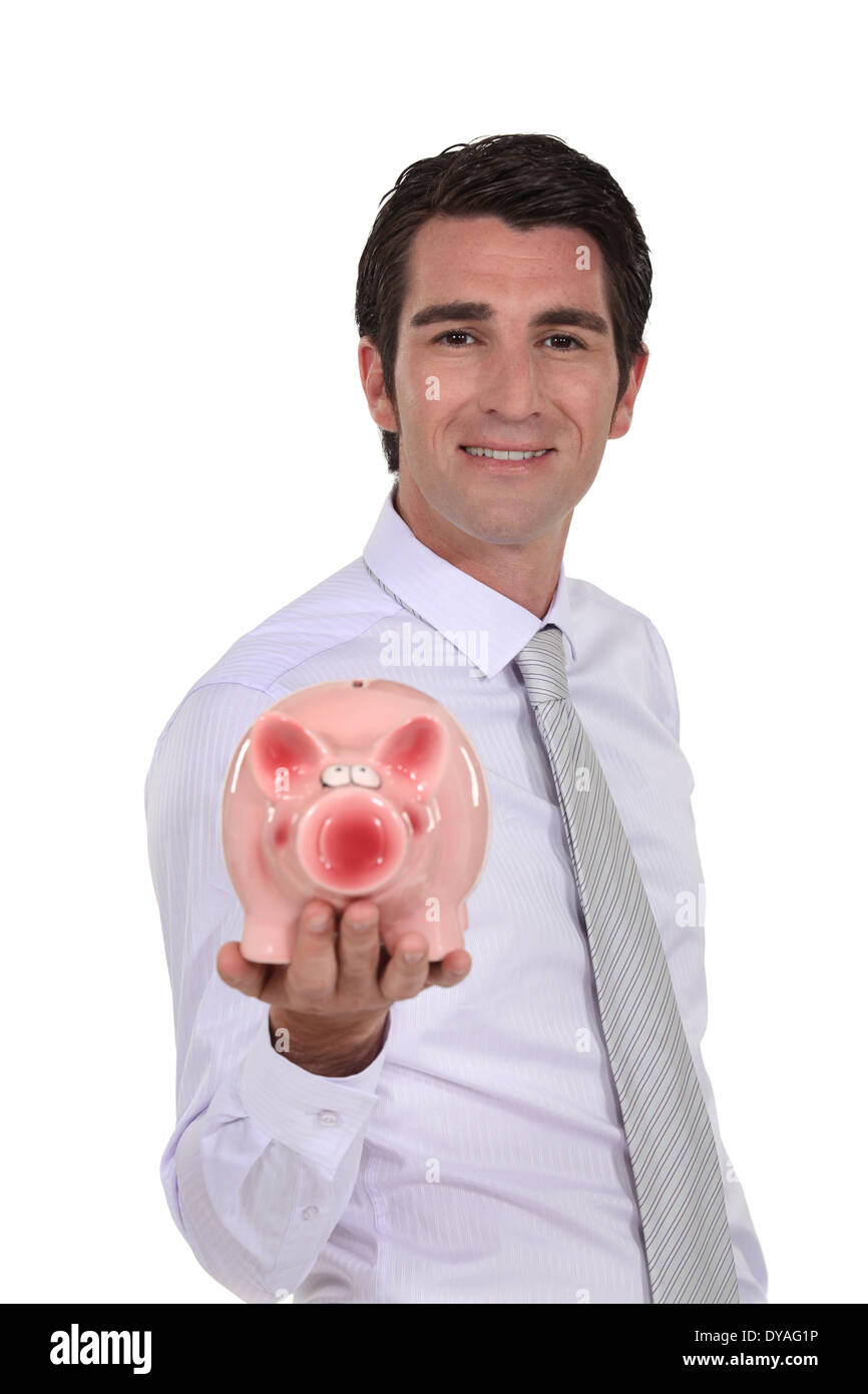 Man holding a piggy bank Stock Photo - Alamy