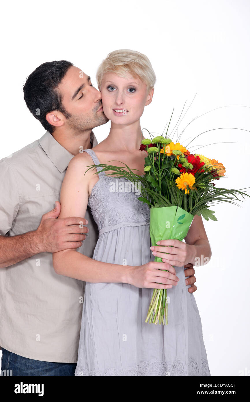 Man giving flowers to wife Stock Photo Alamy