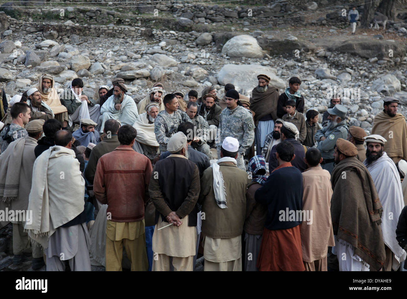 US Navy members with the Kunar Provincial Reconstruction Team, speak to Afghan residents during a shura, or meeting December 7, 2009 in Lachey village, Shigal district, Kunar province, Afghanistan. Stock Photo