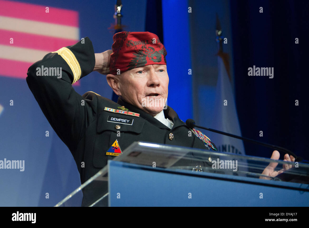 US Joint Chiefs Chairman General Martin Dempsey sings a song during the Operation Homefront 6th Annual Military Child of the Year Awards Dinner at the Crystal Gateway Marriott April 10, 2014 in Arlington, Virginia. The Military Child of the Year Award is presented to the military child from each service who demonstrates resiliency, leadership, and achievement. Stock Photo