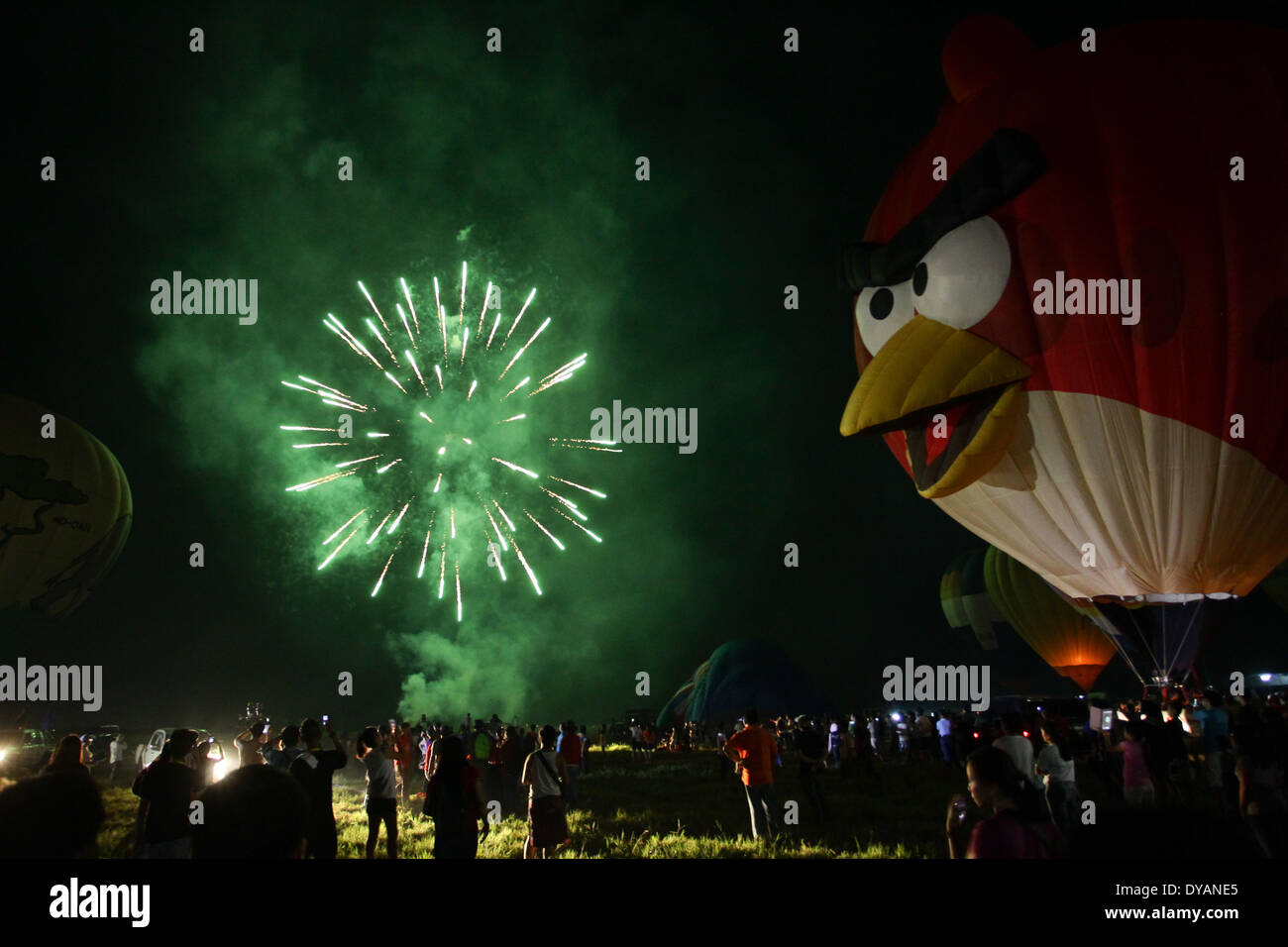 Lubao, Pampanga, Philippines. 11th Apr, 2014. Fireworks light up the sky to cap off the Philippine International Hot Air Balloon Festival on April 11, 2014. The Philippine International Hot Air Ballon Festival featured 21 countries and over 30 balloons. Credit:  Mark Cristino/NurPhoto/ZUMAPRESS.com/Alamy Live News Stock Photo