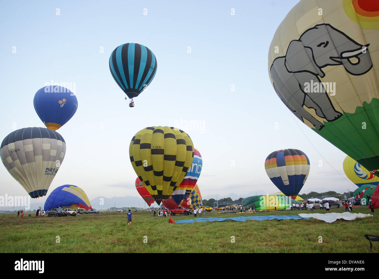 Lubao, Pampanga, Philippines. 11th Apr, 2014. Hot air balloons from different countries get ready for take-off at the Philippine International Hot Air Balloon Festival on April 11, 2014. The Philippine International Hot Air Ballon Festival featured 21 countries with 37 balloons. Credit:  Mark Cristino/NurPhoto/ZUMAPRESS.com/Alamy Live News Stock Photo