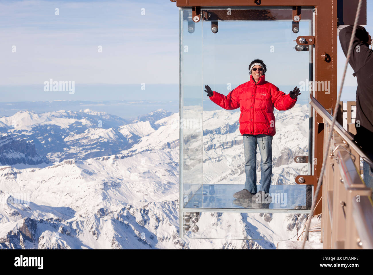 A tourist stands in the 'Step into the Void' glass box on the Aiguille Du  Midi (3842m) mountain top above Chamonix Mont-Blanc Stock Photo - Alamy