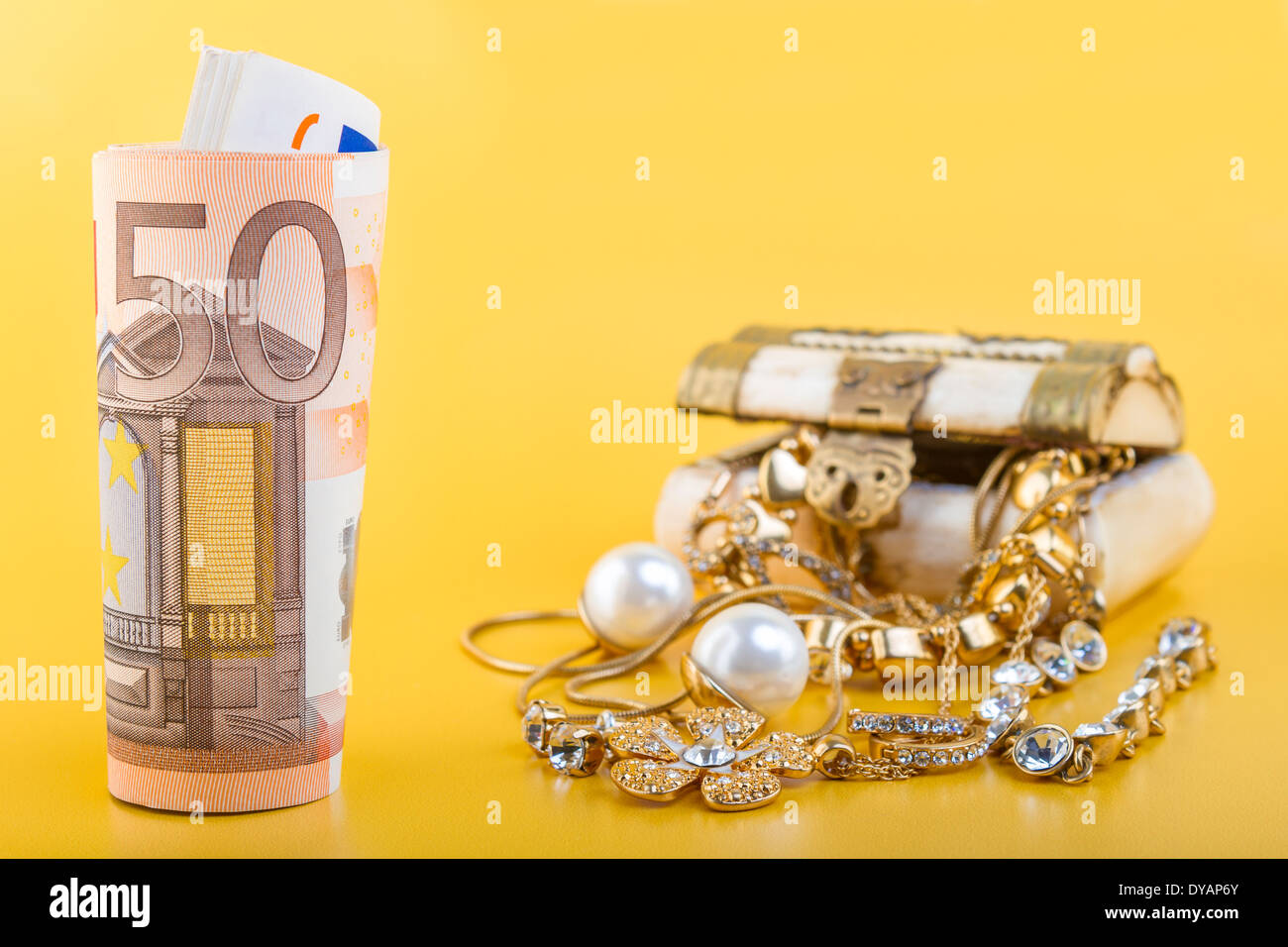 Cash for Gold Jewelry Concept - Concept or Metaphor for selling old gold jewelry for cash Stock Photo