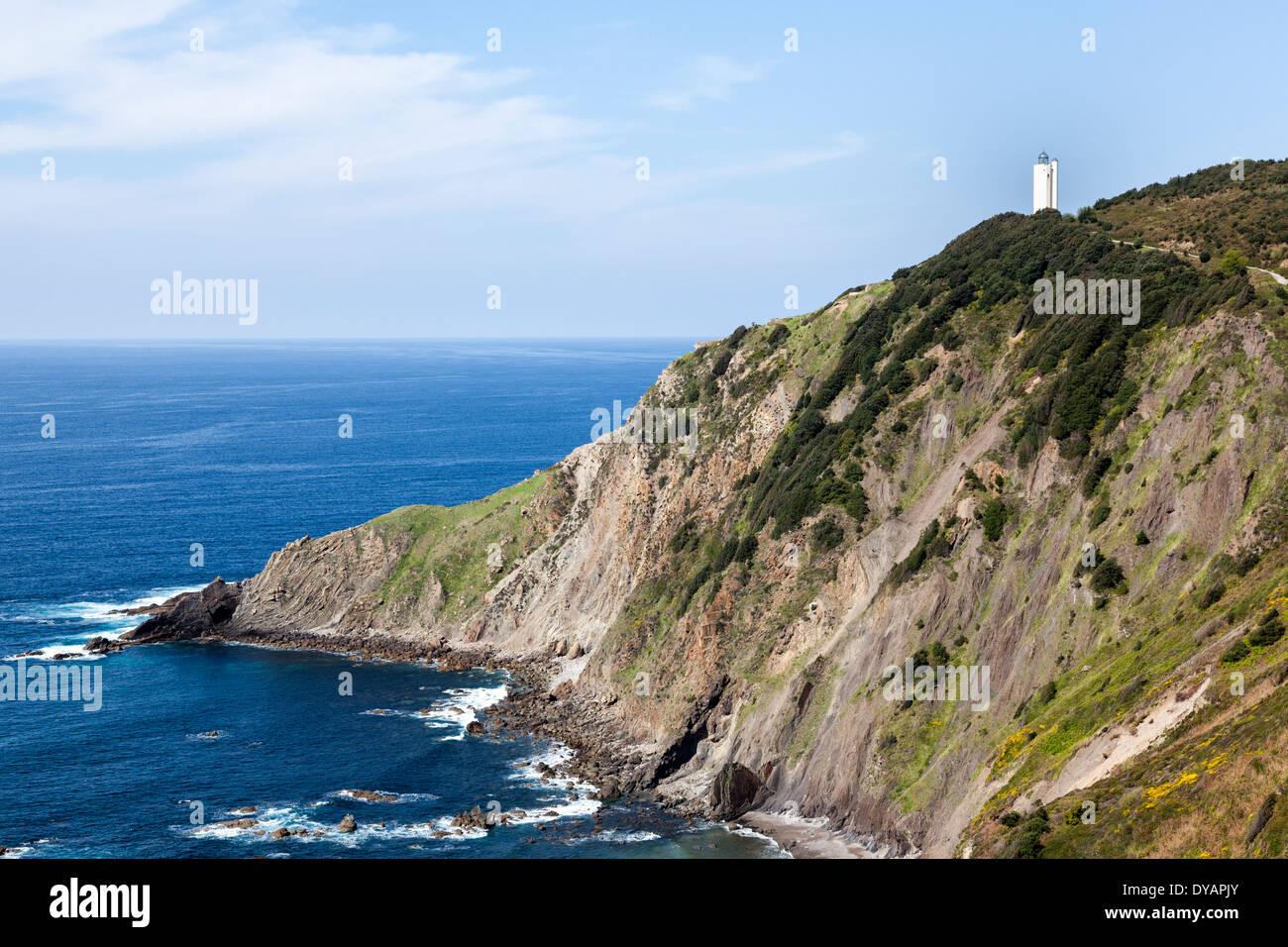 White lighthouse on the cliff, in Gorliz, Basque Country, Spain Stock Photo