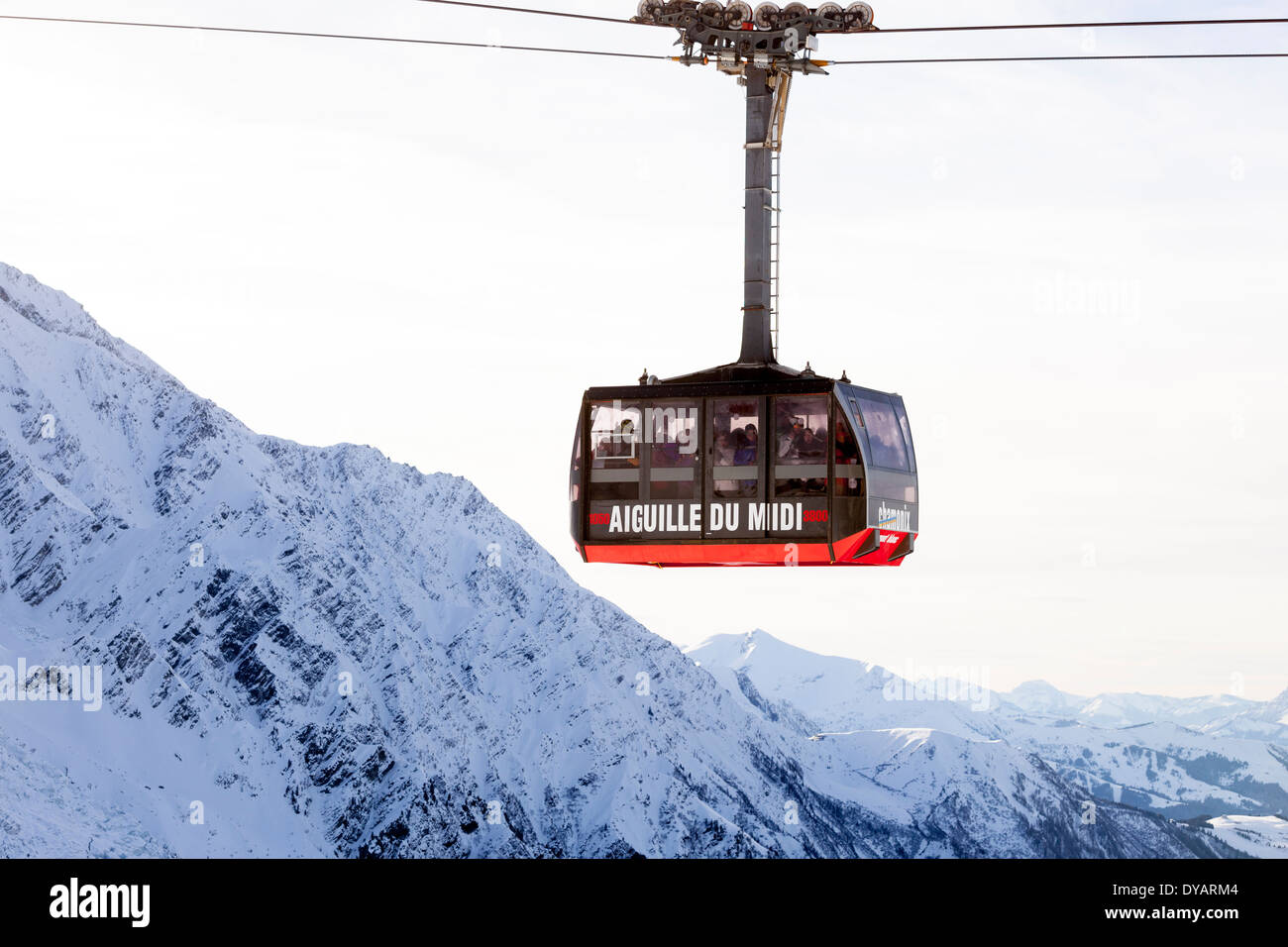 The Aiguille Du Midi gondola, carries passengers to the top of Aiguille Du Midi mountain above Chamonix Mont-Blanc, France. Stock Photo