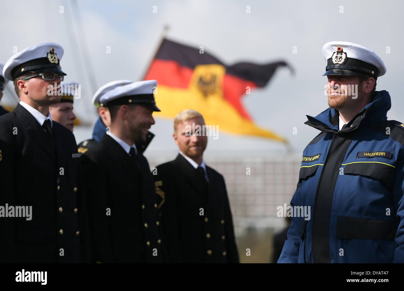 Kiel, Germany. 12th Apr, 2014. Marines stand next to the sail training ship 'Groch Fock' which arrived at the home port in Kiel, Germany, 12 April 2014. The 'Gorch Fock' returned after a five months training journey. Photo: Axel Heimken/dpa/Alamy Live News Stock Photo