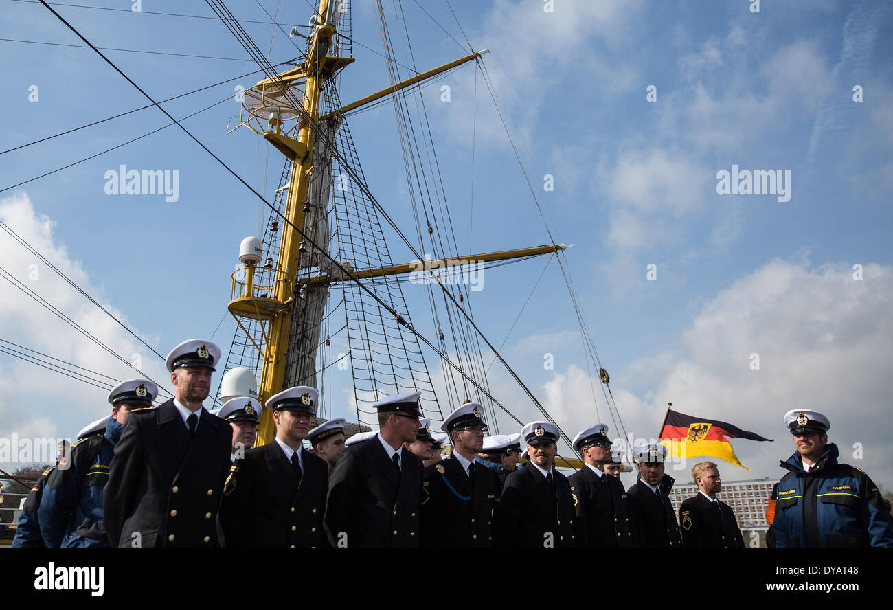 Kiel, Germany. 12th Apr, 2014. Marines stand in front of the sail training ship 'Groch Fock' which arrived at the home port in Kiel, Germany, 12 April 2014. The 'Gorch Fock' returned after a five months training journey. Photo: Axel Heimken/dpa/Alamy Live News Stock Photo
