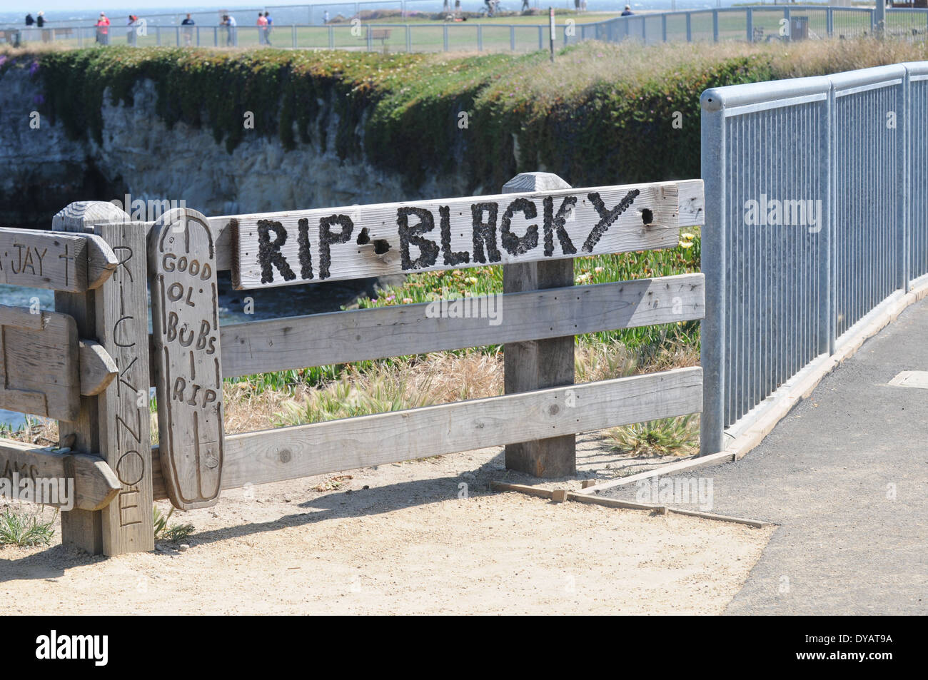 Memorial etched in wood at steamer lane, a popular surfing location off westcliff dr. santa cruz, ca. Stock Photo