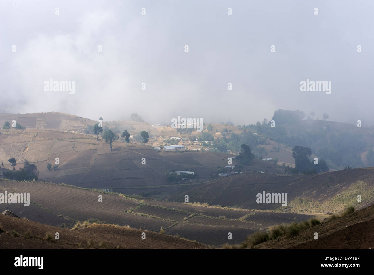 Fields ready for planting on a cloudy mountain side near the village of Pascorral in the western highlands of Guatemala. Stock Photo