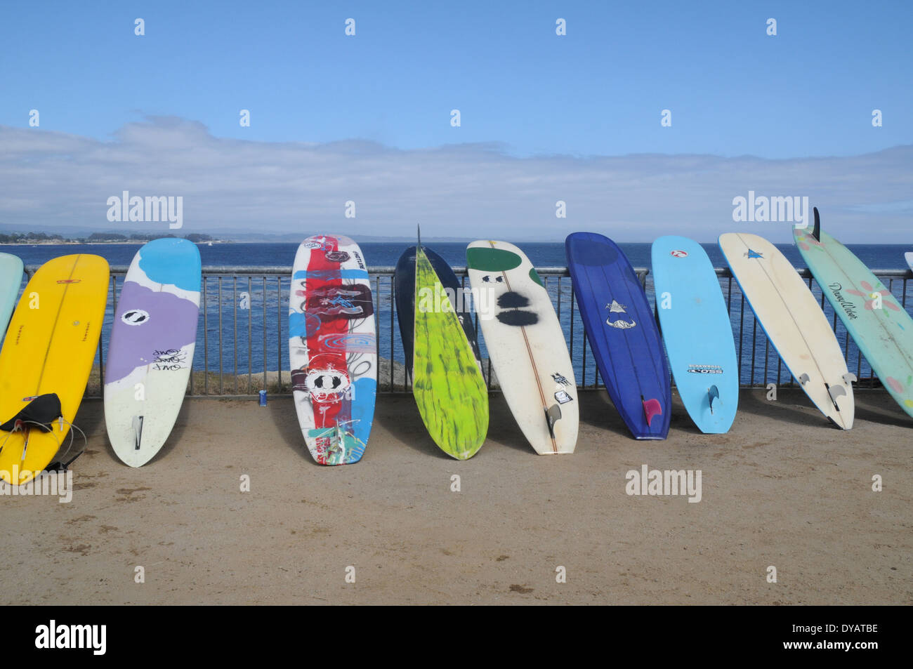 surfboards along the fence in santa cruz california Stock Photo