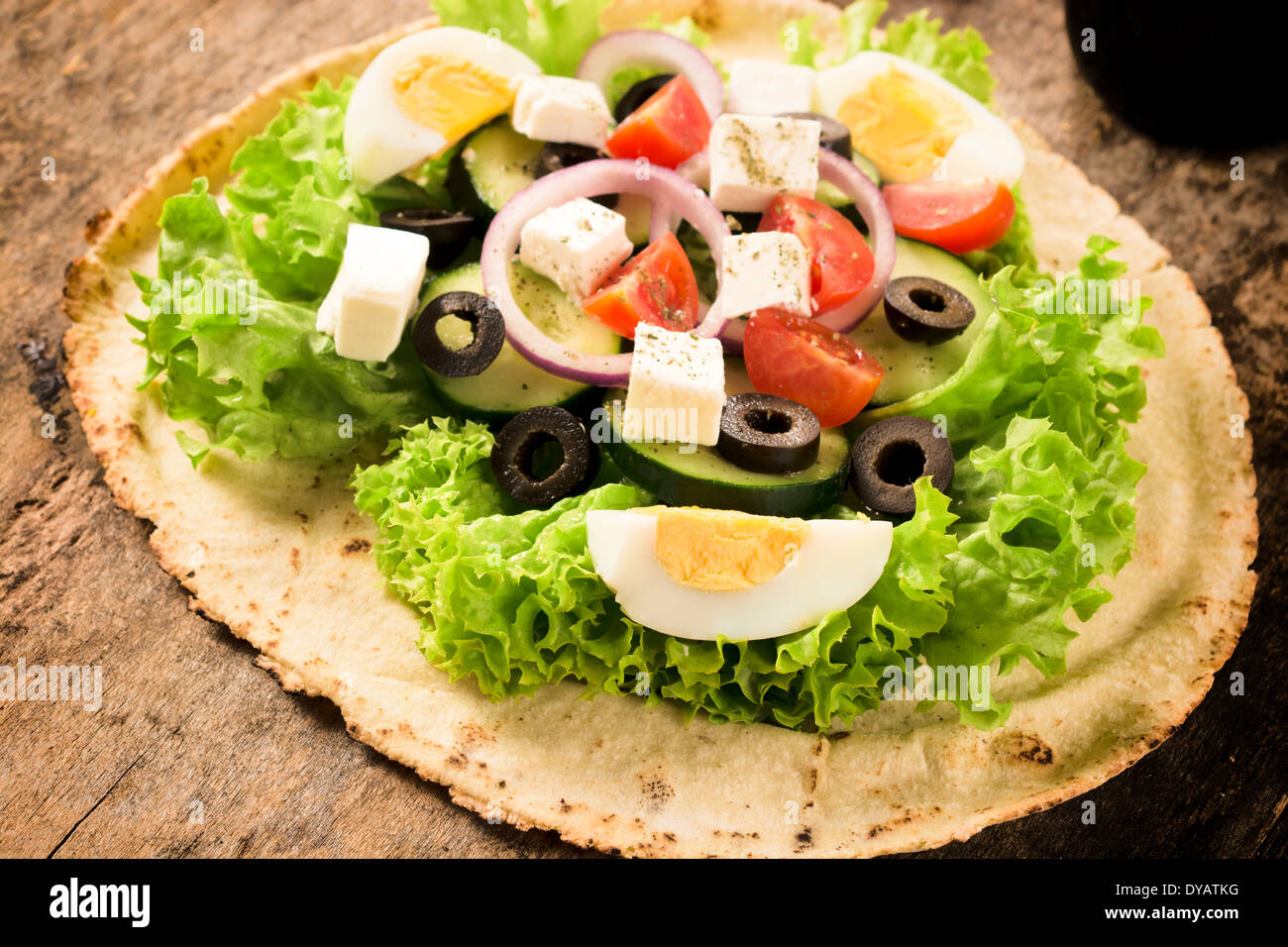 Tortilla bread with fresh spring salad, vegetables and cheese Stock