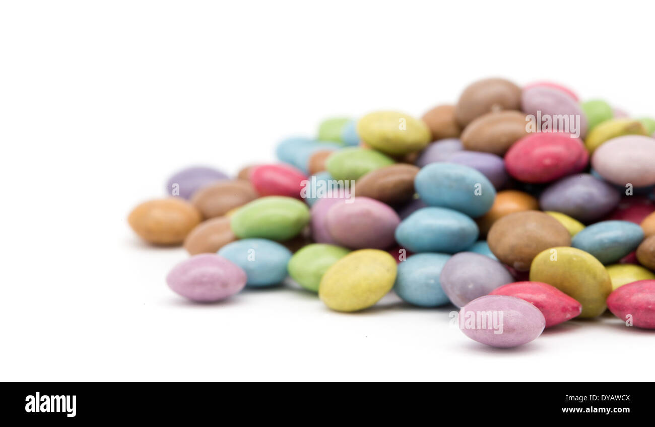 sweet dragees of different color on white background Stock Photo Alamy