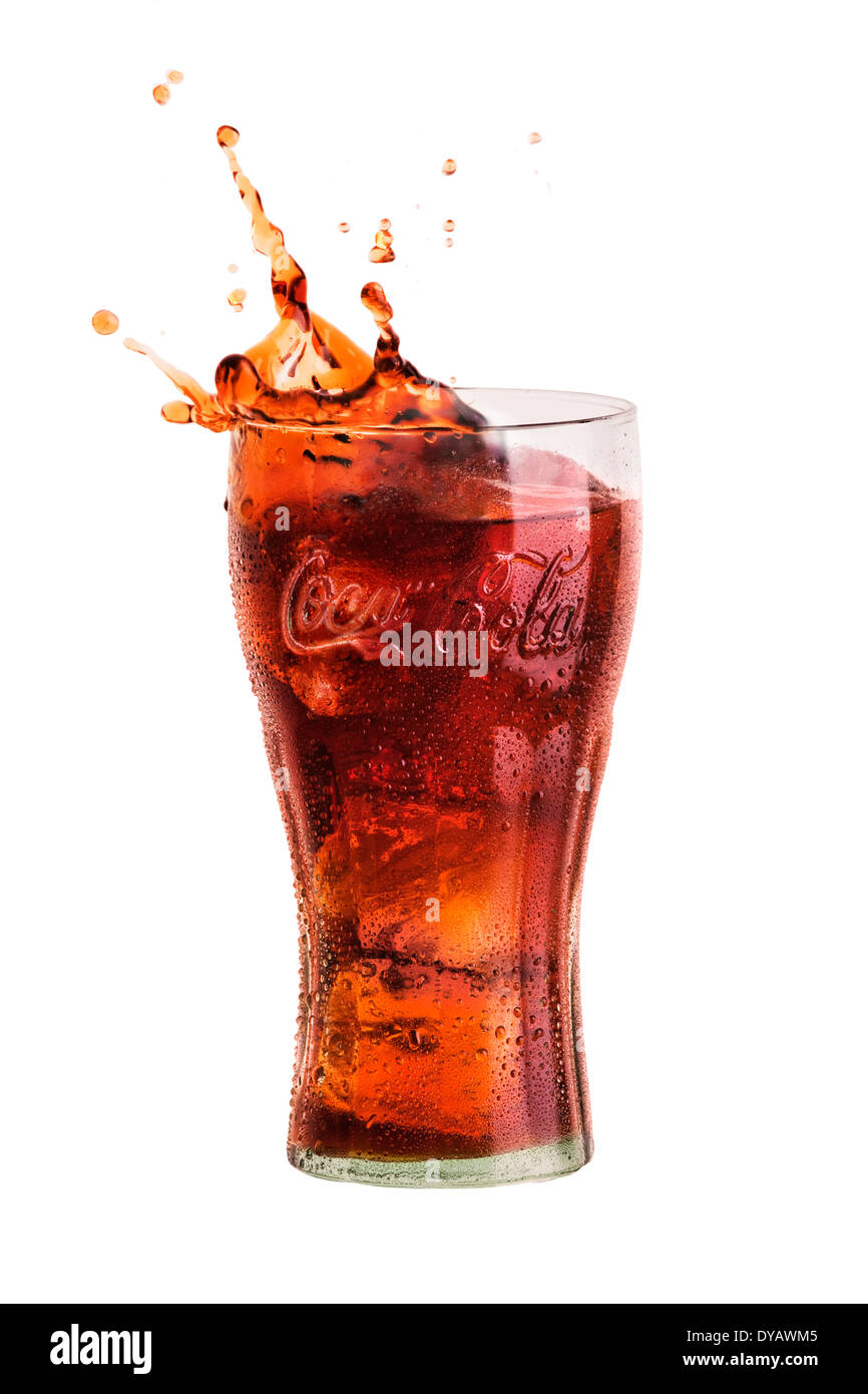 Coke splashing out of glass Stock Photo