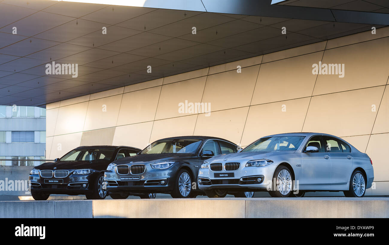 New collection of powerful BMW 535 business and family classes. Three wet after rain cars - the entire model line. Stock Photo