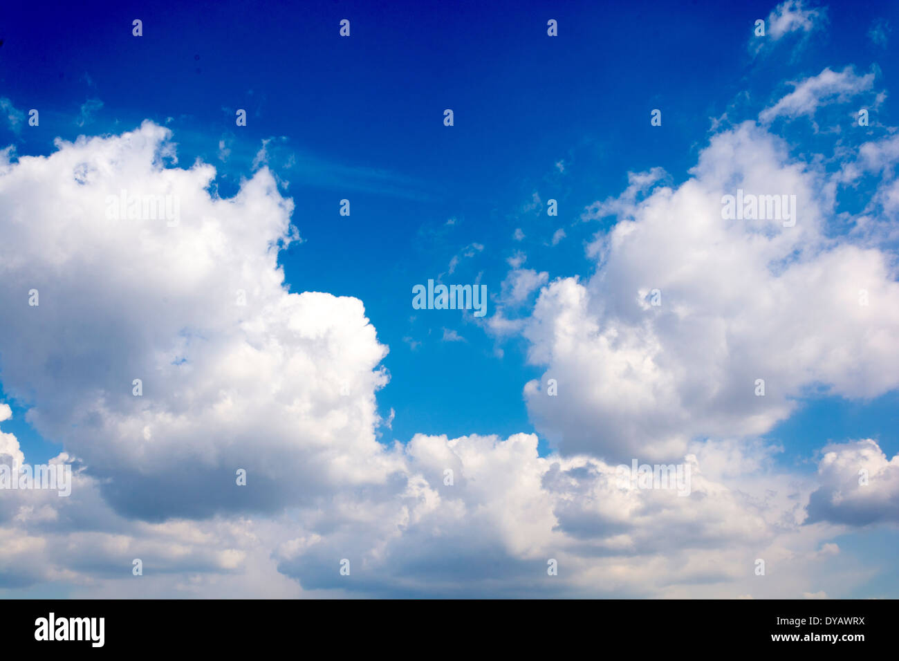Blue sky with fluffy white clouds as background Stock Photo - Alamy