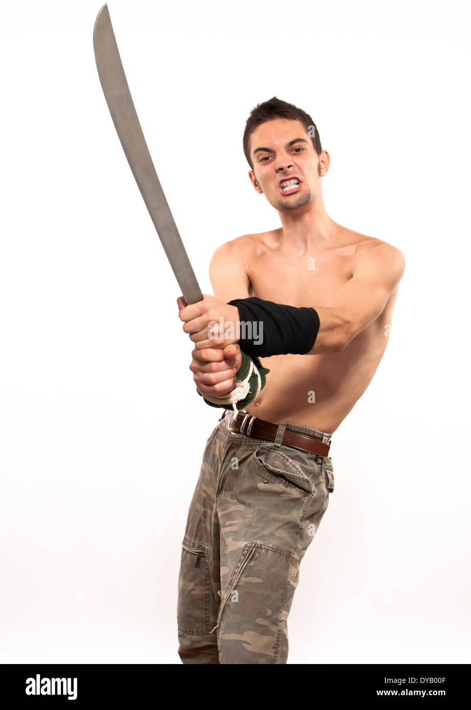 Powerful and aggressive young fighter holding a machete Stock Photo Alamy