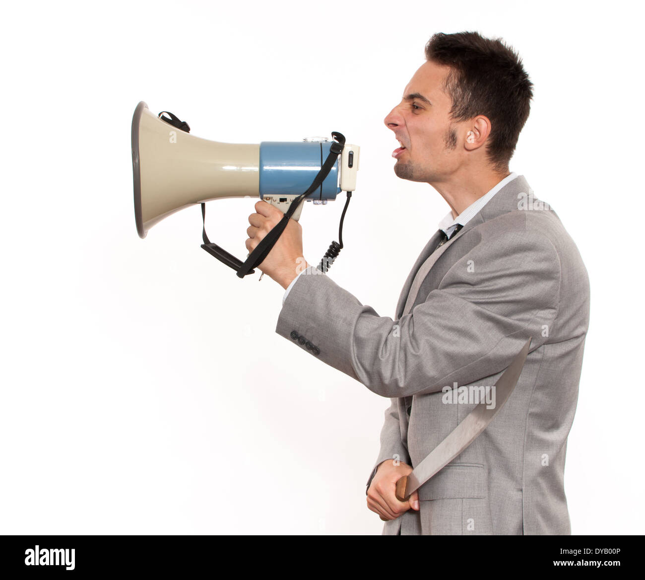 Handsome young caucasian businessman yelling on megaphone Stock Photo