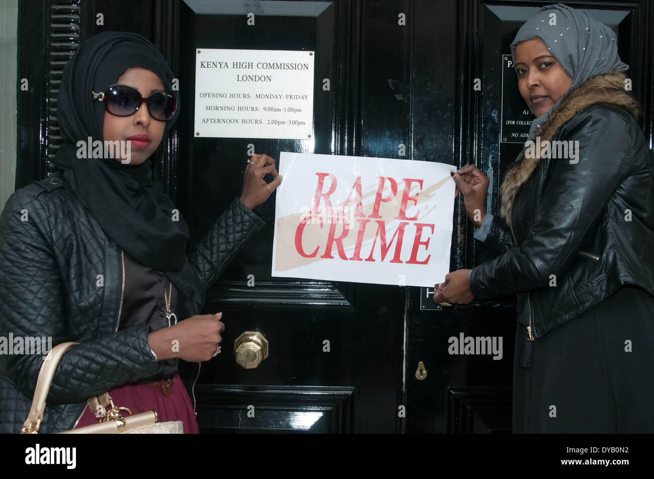 London 12th April 14 : Protesters holding placard at the front of Kenya Embassy in London. Credit:  See Li/Alamy Live News Stock Photo