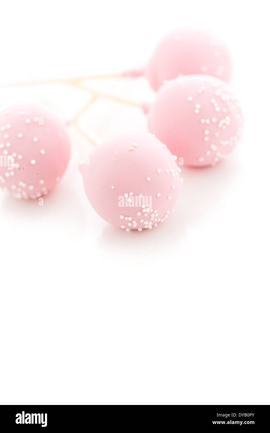 Pink cake pops on a white background Stock Photo - Alamy