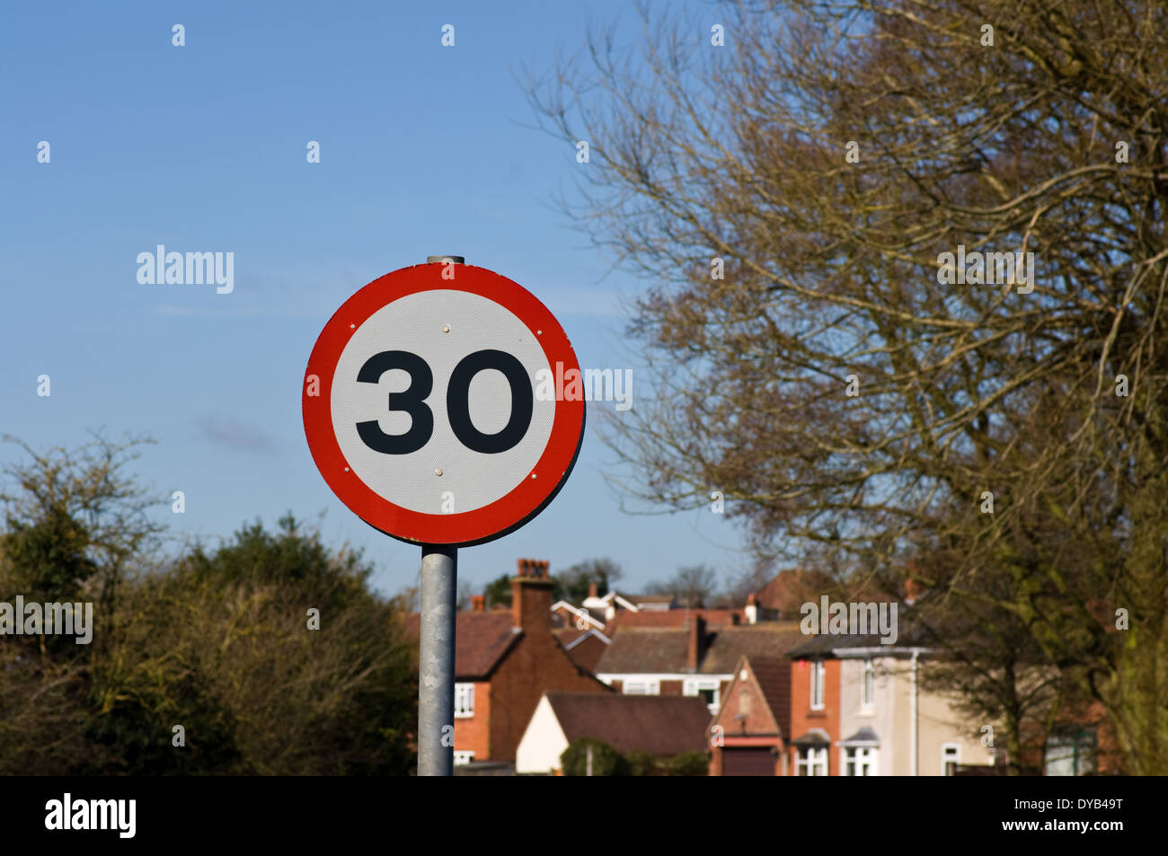 30mph speed sign and housing Stock Photo