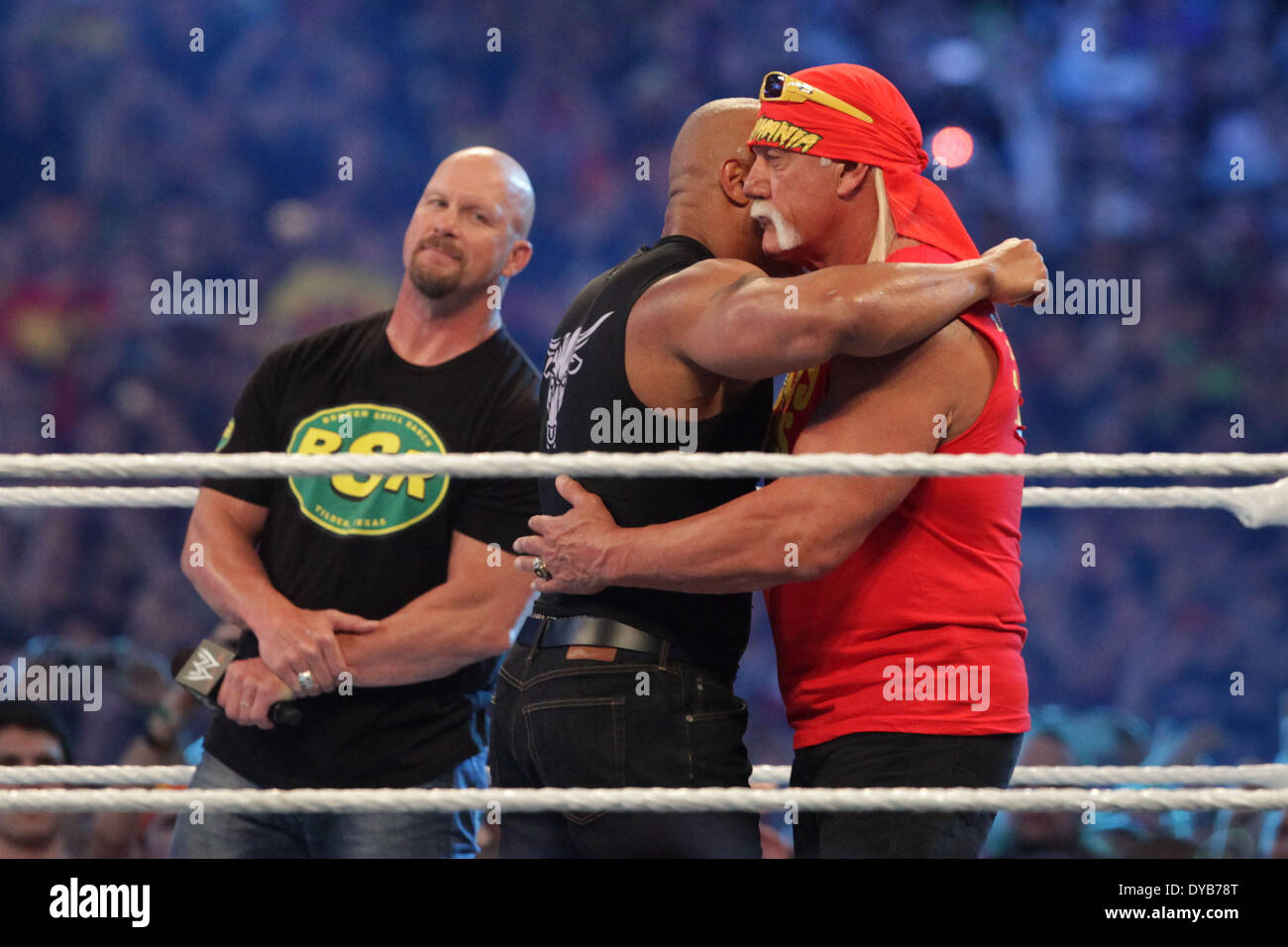 New Orleans, Louisiana, USA. 6th Apr, 2014. Wrestling icon and actor THE  ROCK hugs HULK HOGAN as Steve Austin looks on. All three legends surprised  the fans by returning during Wrestlemaniaat the