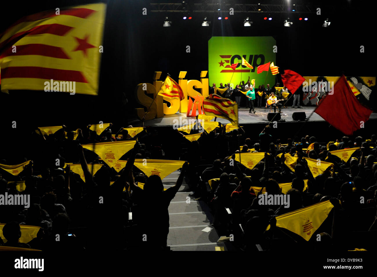 Barcelona, Catalonia, Spain-12th April, 2014.Mass during the meeting of Popular Unity Candidatures (CUP) with Catalan independence flags. Popular Unity Candidatures (CUP), a left-wing Catalan Countries pro-independence party, celebrated a meeting for say yes to catalan independence via a referendum. Stock Photo