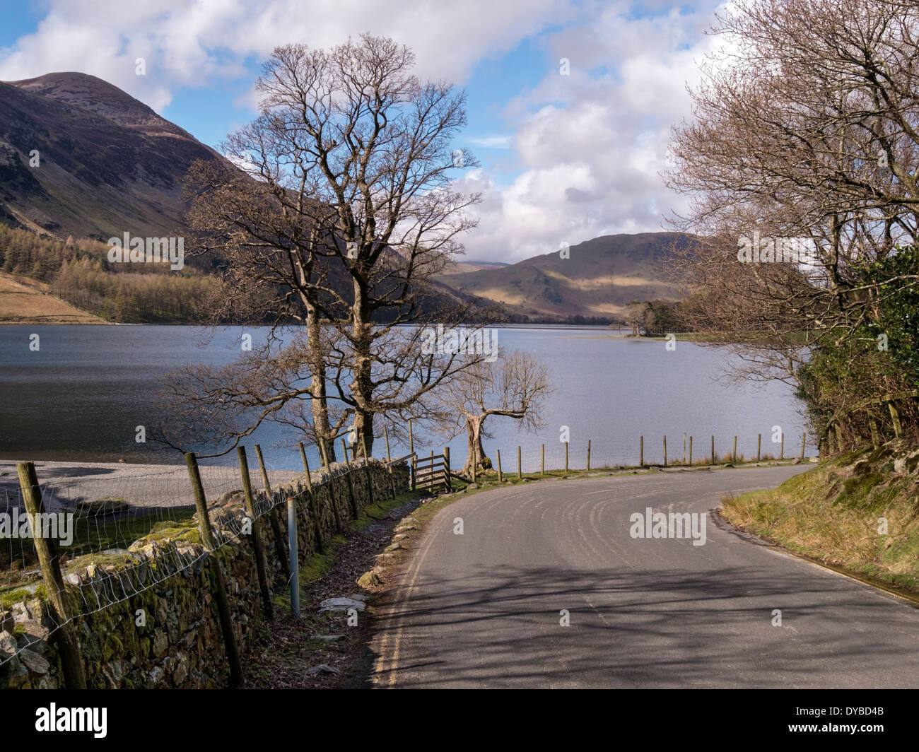Winding road by the shores of Lake Buttermere in the English Lake District, Cumbria, England, UK Stock Photo