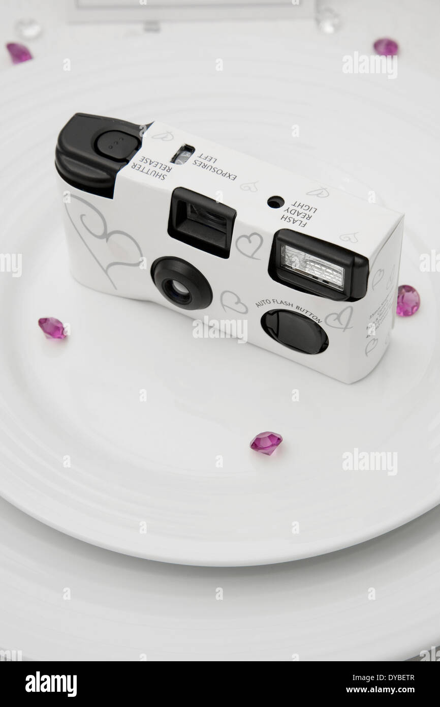 Disposable White Wedding Camera On A Wedding Table Stock Photo