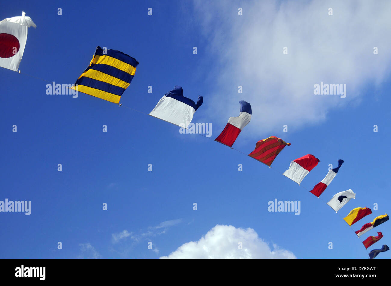 Flags of various countries blowing by the wind in a sunny day, Oahu, Hawaii, USA Stock Photo