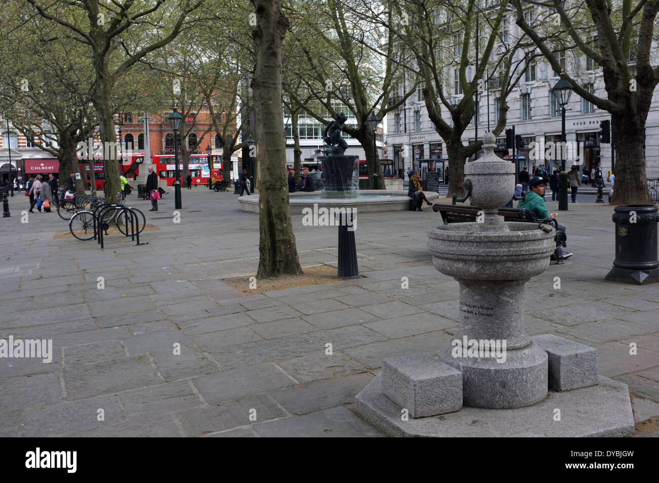 sloane square is a small hard-landscaped square on the boundaries of the west london districts of  chelsea, belgravia Stock Photo