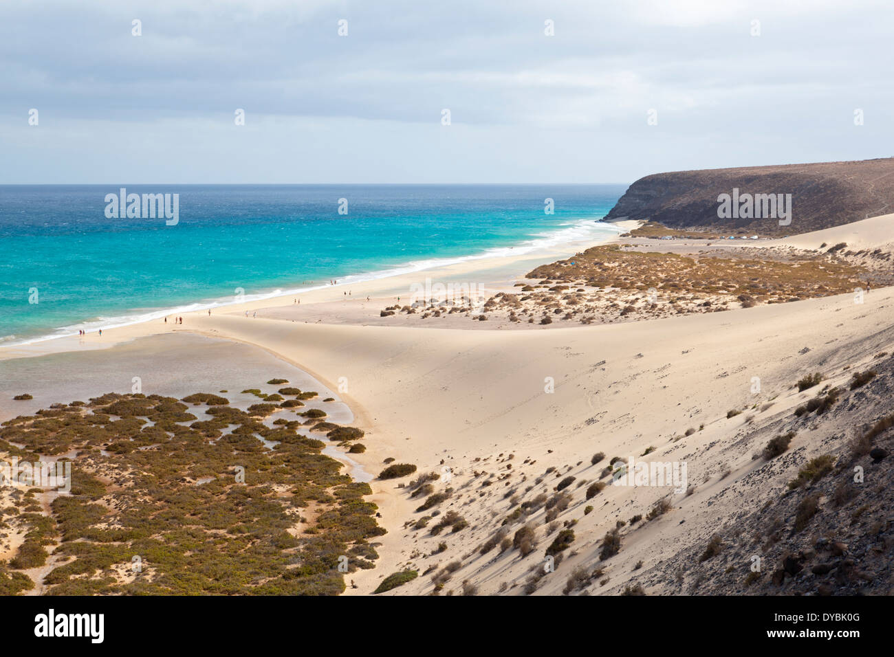 Playa de Sotavento with its beautiful lagoon and some tourists next to a large dune. Stock Photo