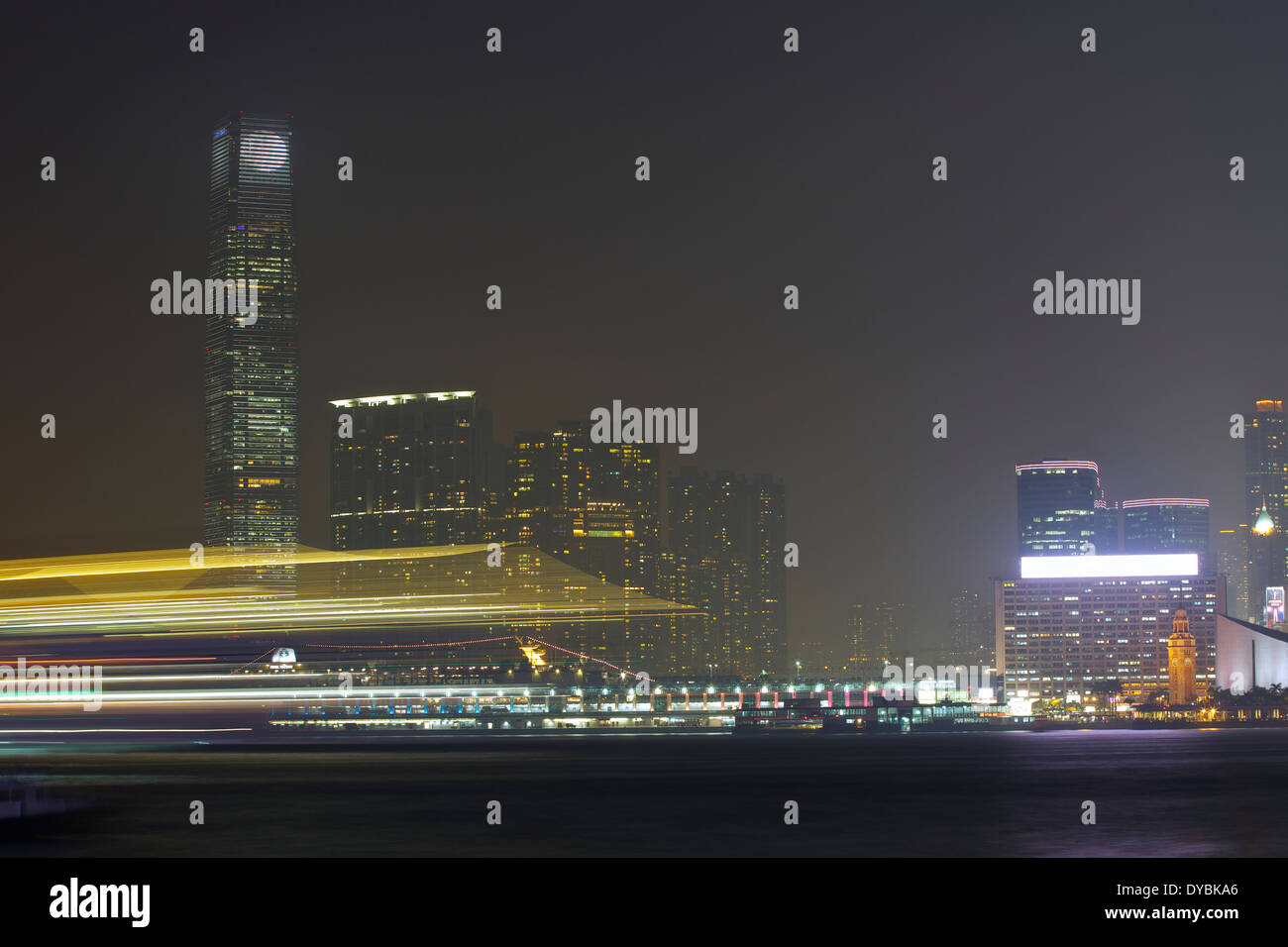 Motion Blur Of A Ship Passing in the Night, Victoria Harbour, Hong Kong. Stock Photo