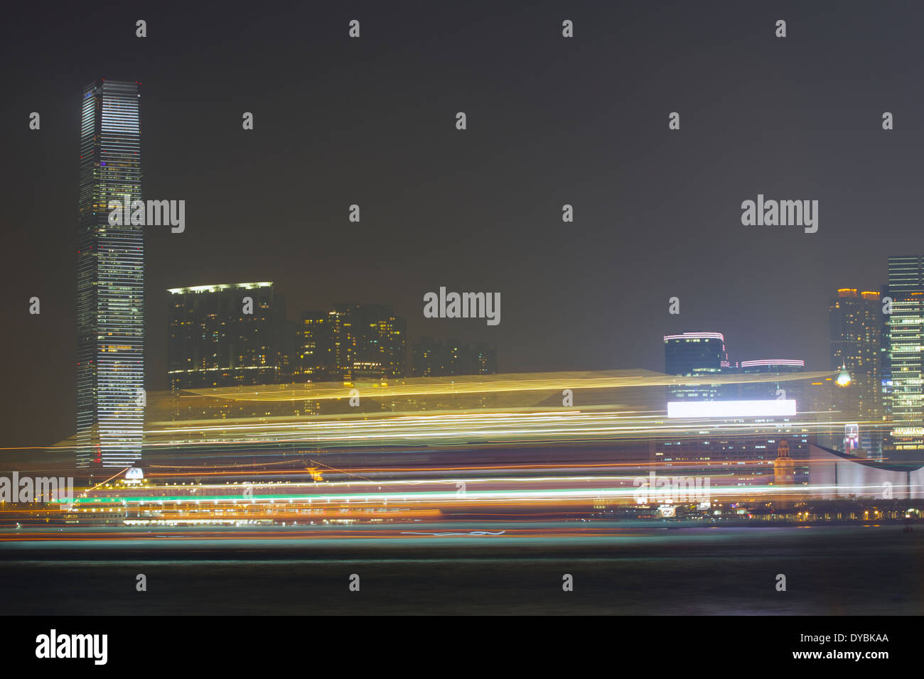 Motion Blurred Ship Passing in the Night, Victoria Harbour, Hong Kong. Stock Photo