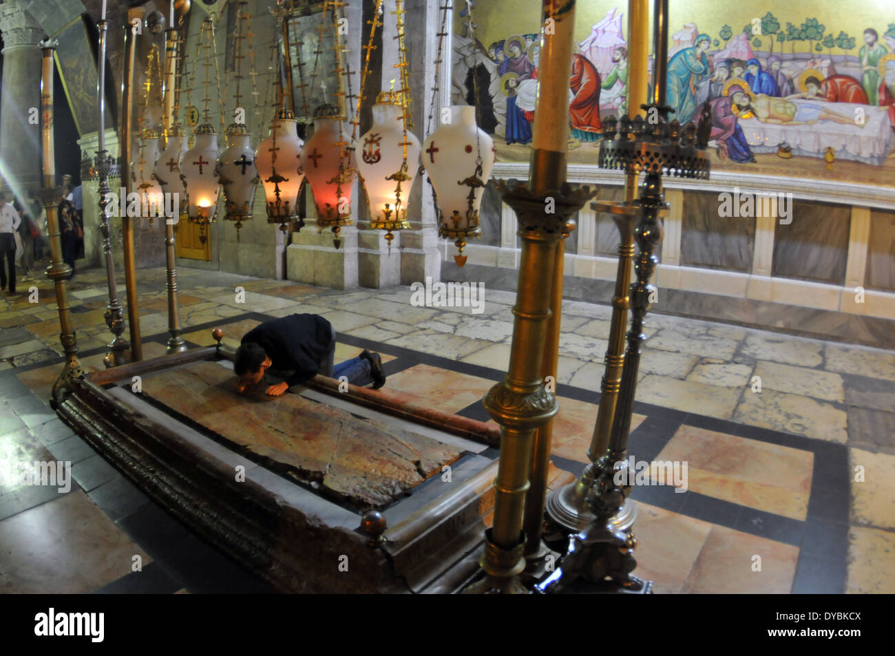 Devotee worships the stone of the anointing, Church or Basilica of the Holy Sepulcher, Christian quarter, Jerusalem, Israel Stock Photo