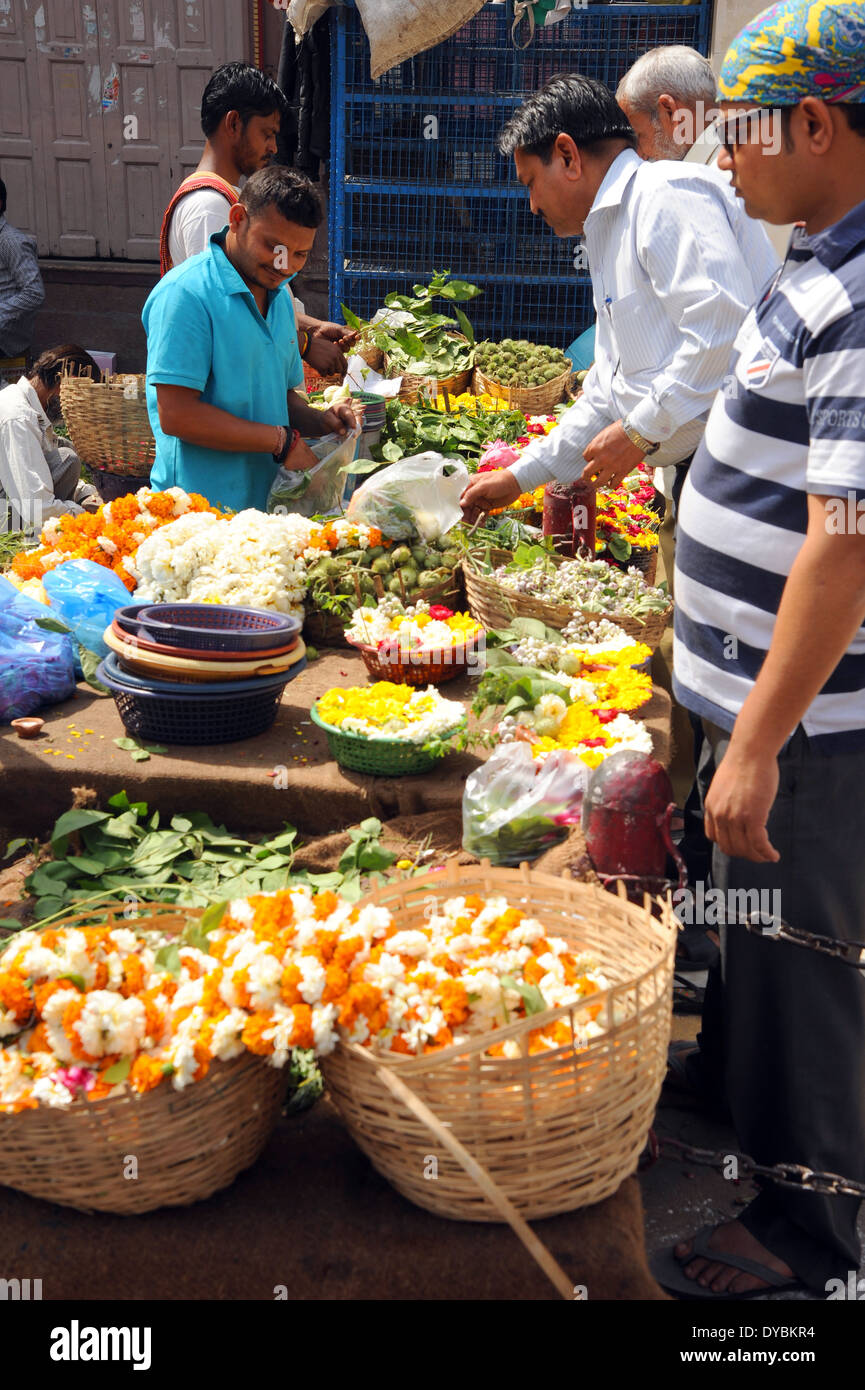 Delhi, India. April 6th 2014. A man selling flowers for religious use. Stock Photo