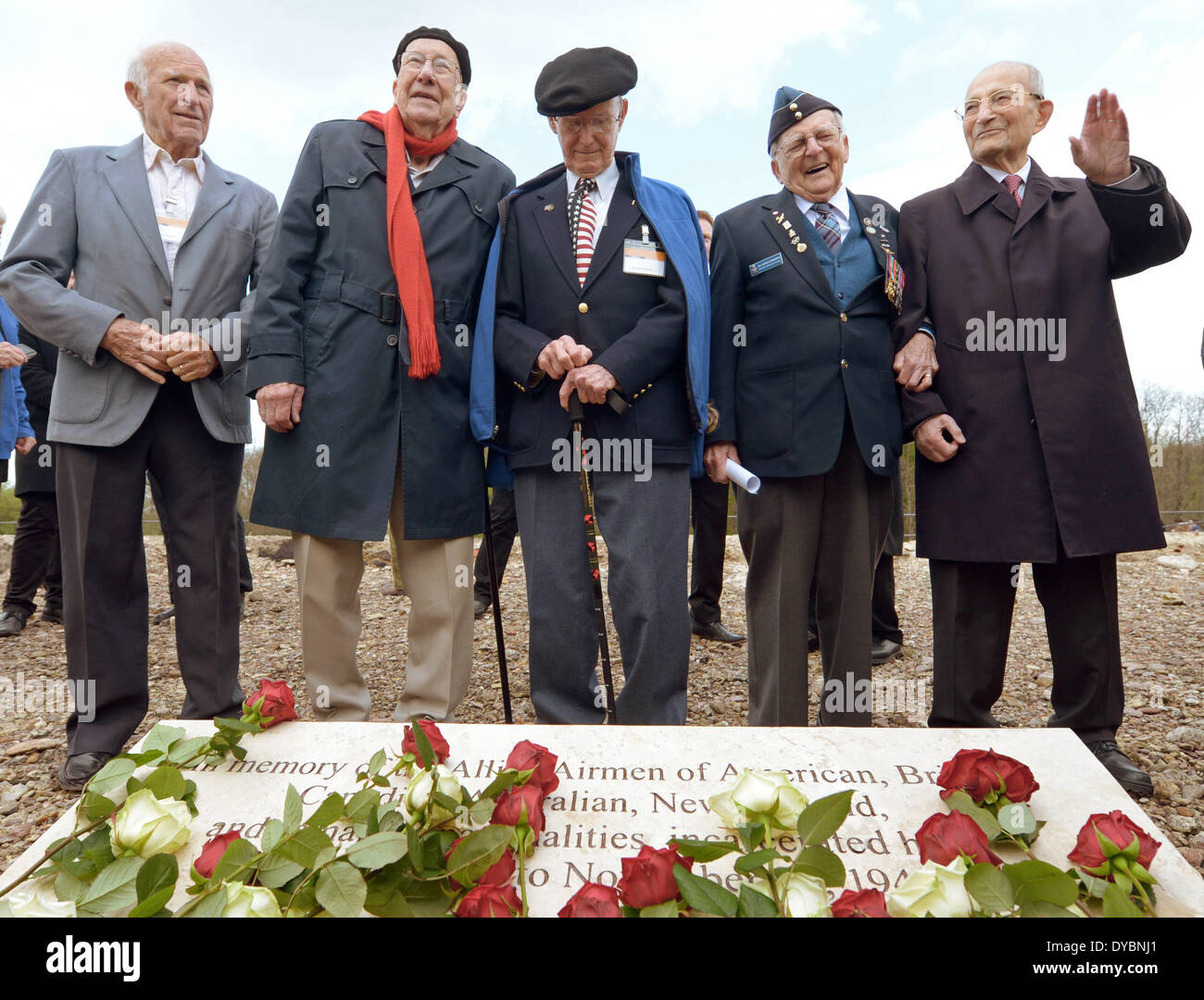 Weimar, Germany. 13th Apr, 2014. The former deported members of the allied air force Chasten Bowen (L-R), Richard Bedford, Donald Shearer and Ed Carter-Edwards and the president of the international committee Buchenwald-Dora and command Bertrand Herz, stand in front of a plaque during the 69th anniversary of the liberation of the concentration camp Buchenwald, near Weimar, Germany, 13 April 2014. Photo: Jens-Ulrich Koch/dpa/Alamy Live News Stock Photo