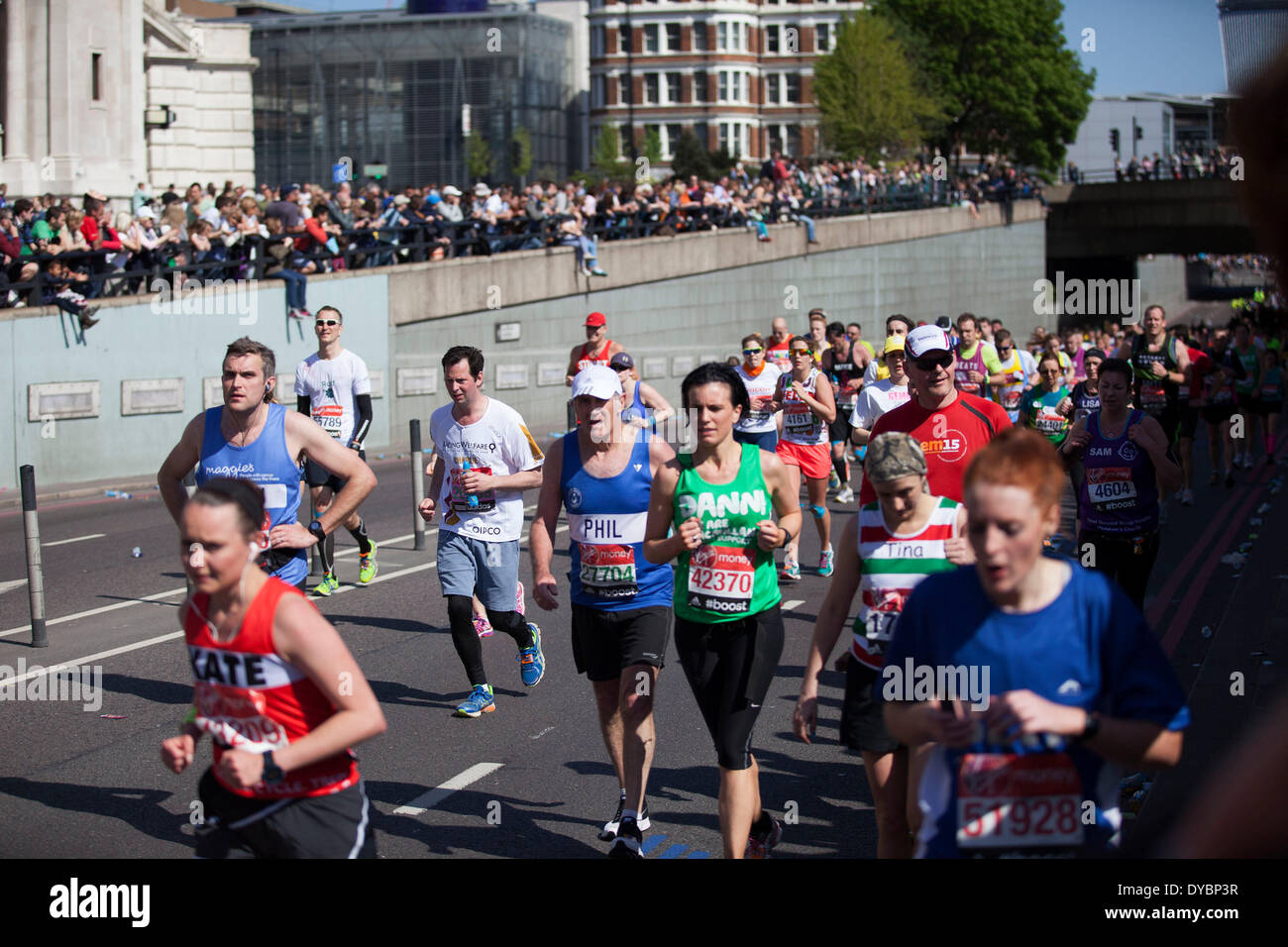 London, UK. 13th Apr, 2014. Competitors running in the main public event of the Virgin Money London Marathon 2014. These runners take part and raise huge sums fo money for charity organisations. Credit:  Michael Kemp/Alamy Live News Stock Photo