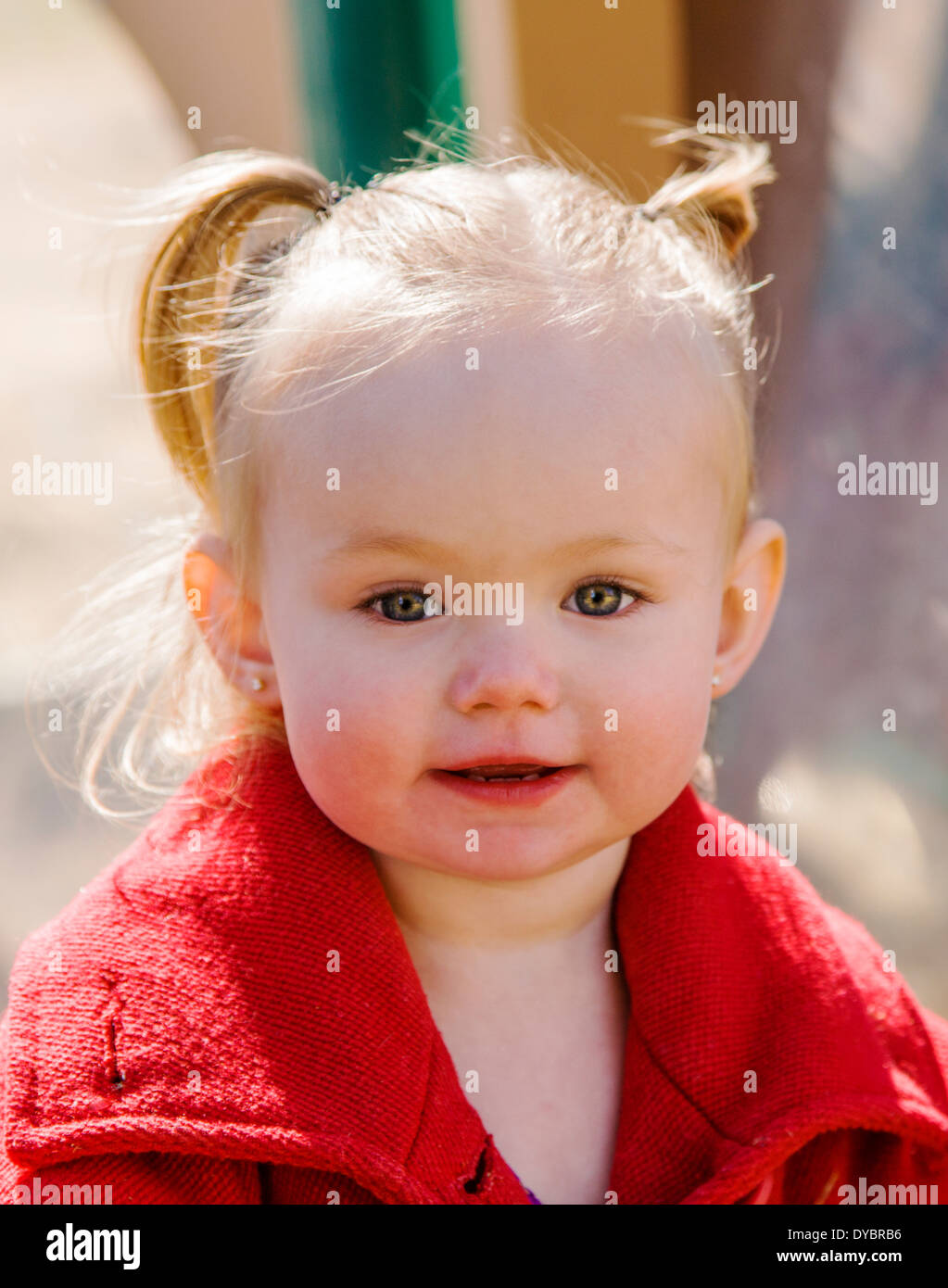 Cute, adorable 16 month little girl playing on a park playground Stock Photo