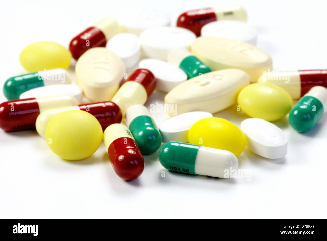 Antibiotics - a mixture of antibiotic capsules and tablets on a white background, UK Stock Photo