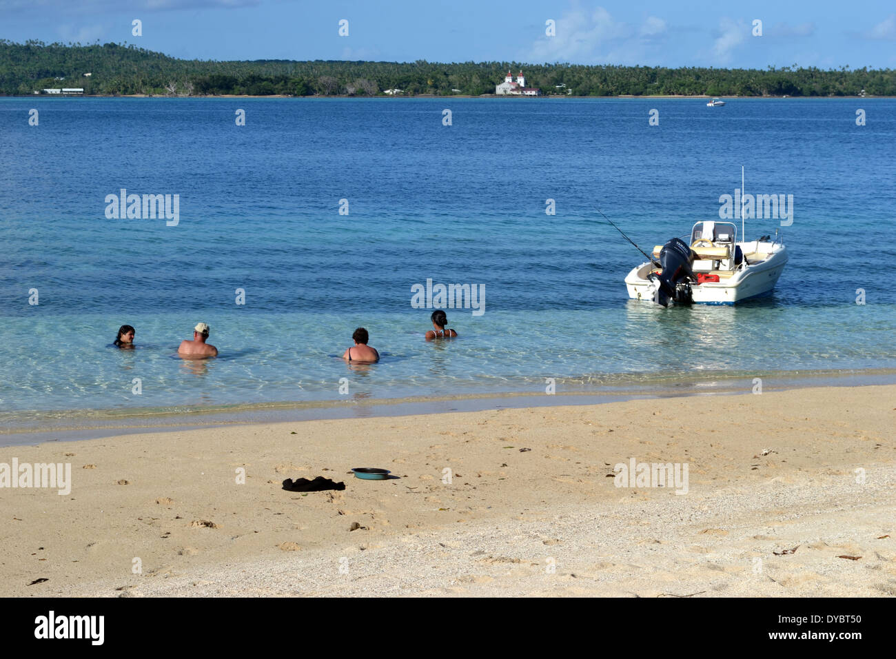 Group of people enjoy a tropical beach in Nukutapu islet, Wallis Island, Wallis and Futuna, South Pacific Stock Photo