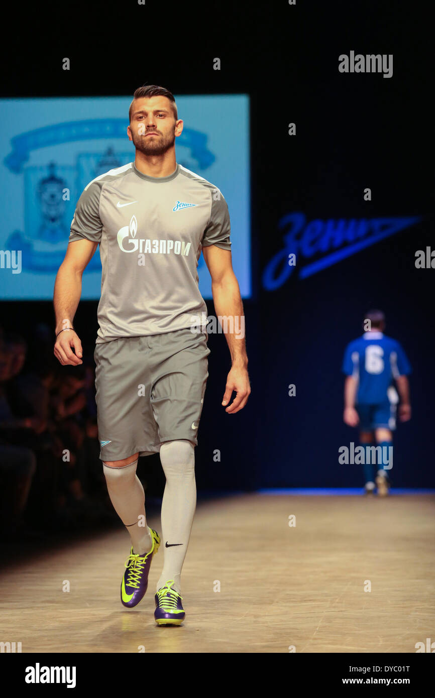 St. Petersburg, Russia. 13th Apr, 2014. Goalkeeper of FC Zenit Yury Lodygin  presents with new shirts of FC Zenit during a defile of Zenit retro uniform  during Aurora Fashion Week in St.