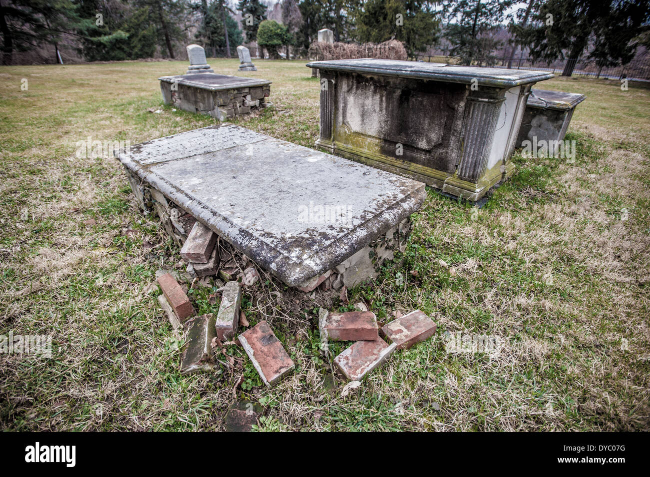 Aged, broken, destroyed grave site at the Rogers Buchanan Cemetery Stock Photo