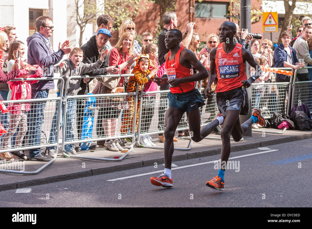 Lower Thames Street, London, UK, 13 April 2014, near mile 23, Virgin Money London Marathon 2014.  Wilson Kipsang (right) and Stanley Biwot, both Kenya. Kipsang would go on to beat Biwot into second place, and win the race in a course record time of 2:04.27, and earn his second London Marathon title.   Credit:  Stephen Chung/Alamy Live News Stock Photo
