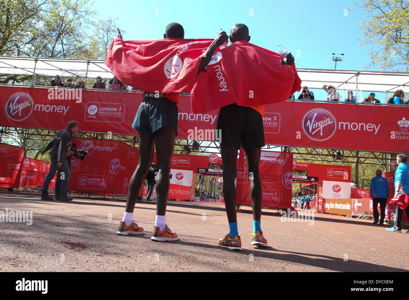 London, UK. 13th Apr, 2014. BIwott and Kipsang in prayer after the finish of the 34th London Marathon. They came second and first respectively. Credit:  David Mbiyu/Alamy Live News Stock Photo