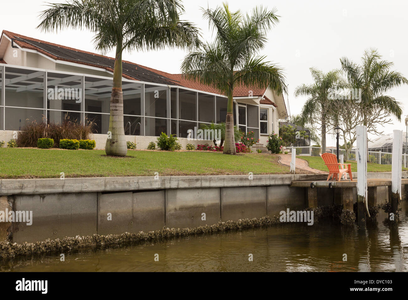 Luxury Residential Canal Front Home with Screened in Pool Deck and