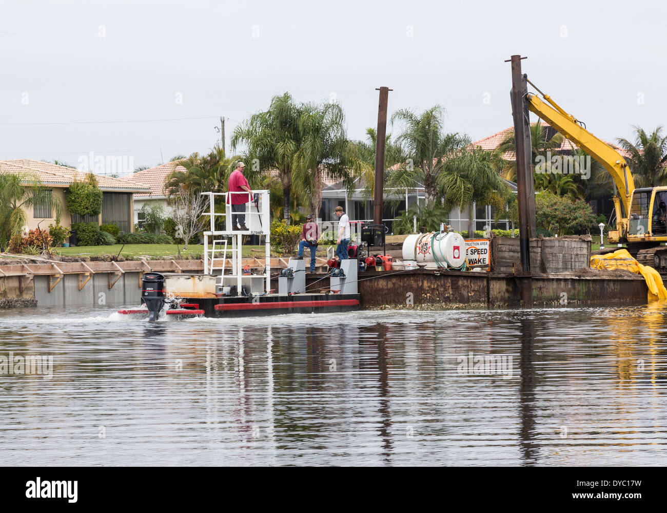 Construction Crew Preparing Canal Sea Wall, Punta Gorda, FL, USA Stock
